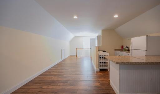 Approx 640 sq ft of finished area above garage includes a living room area, kitchen, full bath, mini split heat pump