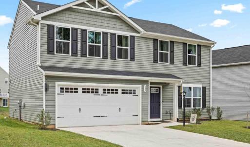 concrete paved driveway and 2 car garage