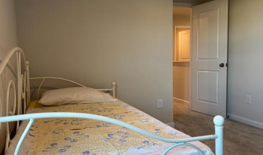 Showing a single width bed, 2 other walls can accomodate a queen width easily too