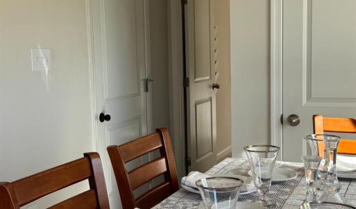 Pantry cupboard on the right, garage door on the left, down the hall is the main floor half bath and past that, the office