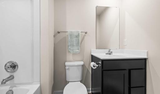 The upstairs hall bath is between bedrooms 3 and 4 on the back of the house.