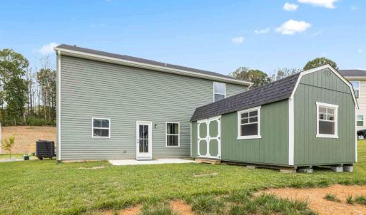 Seller added a terrific shed on the back of the house~ which conveys.