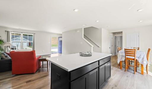 The large and handy island has seating on the back side.