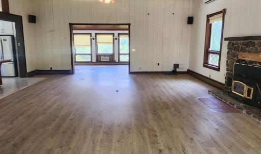 Open Living Room/Entertainment area with fireplace