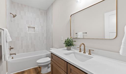 Second full bathroom with tile tub/shower