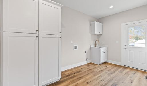 Large laundry room with side entrance.  Great drop zone and lots of extra storage!