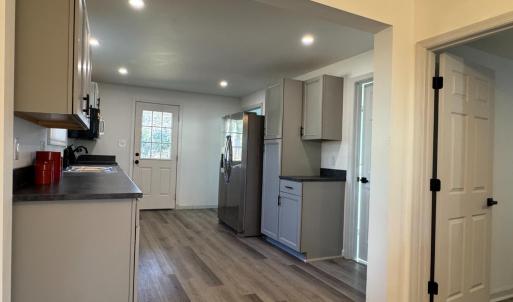 The downstairs bedroom is right off the "Dining Room area just before the kitchen