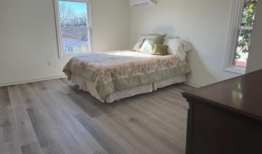 The front bedroom is 12'8"x11'8". Pictured here is a queen sized bed; it can easily fit a king sized bed!