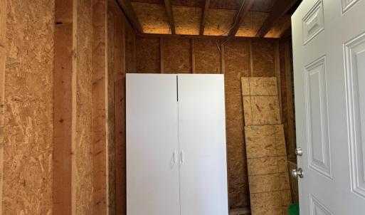 Inside the 7'8" x7'3" attached storage shed at back patio