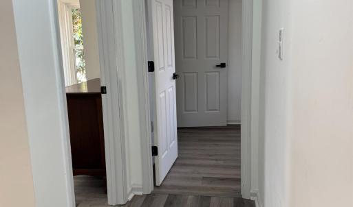 At the top of the stairs is the other full bathroom. Door to the left is the front bedroom and at the end of the hall is the back bedroom