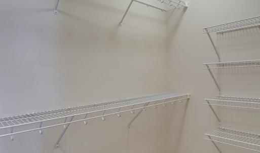 Walk-in closet in primary bedroom