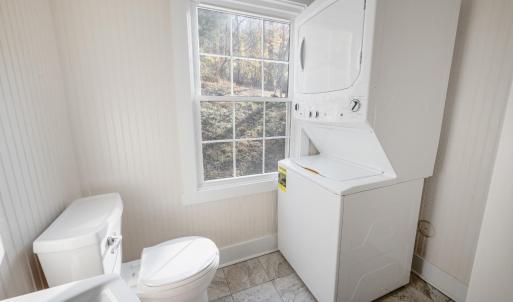 Main level bathroom with stackable W/D