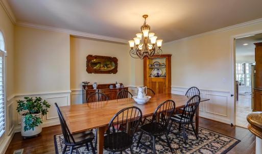 Spacious dining room off kitchen with custom plantation blinds!