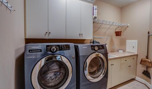 Large laundry room with ample cabinet space!