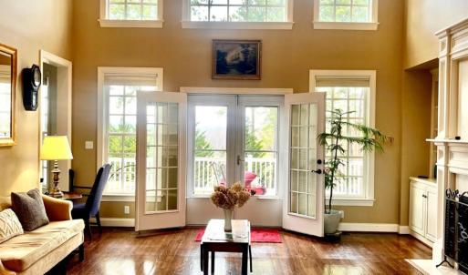 Gorgeous entry to formal living room with gas logs and lots of natural light!