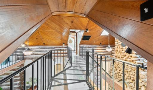 Plexiglass Walkway connecting Upper BRs & above the Living Room