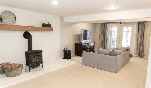partially finished basement with wood stove for extra warmth