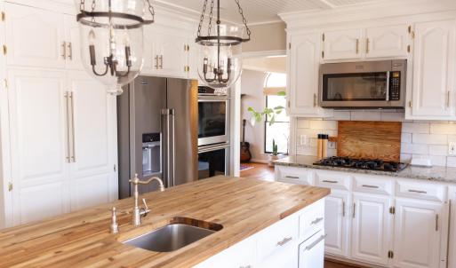 Kitchen with 2 dishwashers, pre sink and kitchen sink, double oven, gas cook top and built in microwave