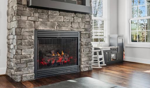 Beautiful Rock Fireplace -  Picture is photo shopped -                                                                                                                                 There is NO propane tank at the home