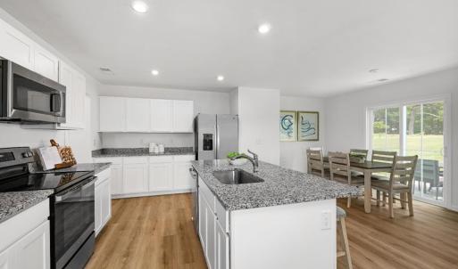 Similar to Photo - Kitchen & Dining Area