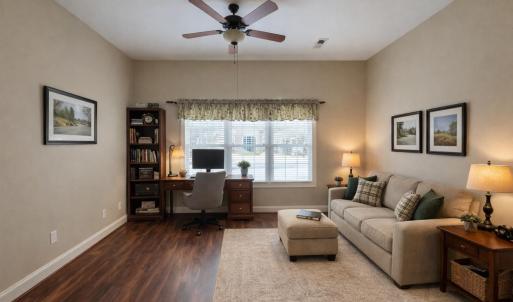 Flex space off of primary bedroom virtually staged as Den.