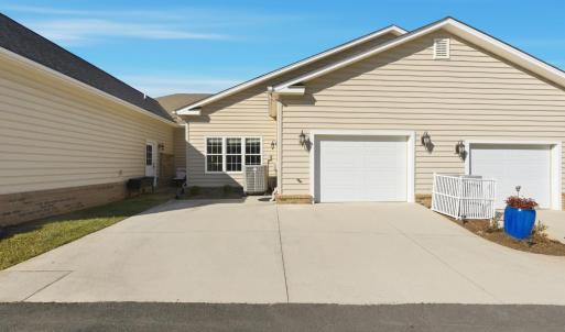 One car, oversized garage and additional parking pad for second car.