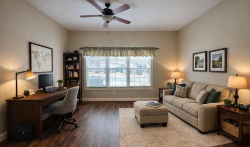 Flex space off of primary bedroom virtually staged as office and den combo.