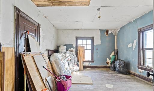 Bedroom 4 at the back of the house... this is what the whole house looked like originally! Materials convey.