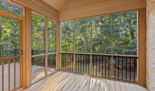 Screened in porch with TV and surround sound outside exterior.