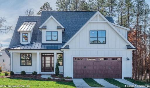 Photo is a rendering of house plan. Finishes will vary and are to be made at builder's discretion. Please reach out for confirmation of exact finishes throughout home. Plans for brick and wood board and batten on exterior.