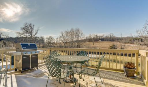 Relax on the main level deck overlooking pristine back yard, with creek, serene setting.