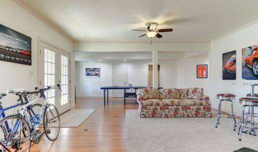 Lower level den, spacious, airy, leading to patio.