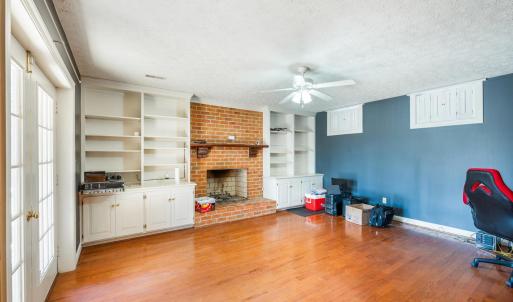 Rec Room/Office with Wood Burning Fireplace. Double Doors leading to the patio already wired for a Hot Tub