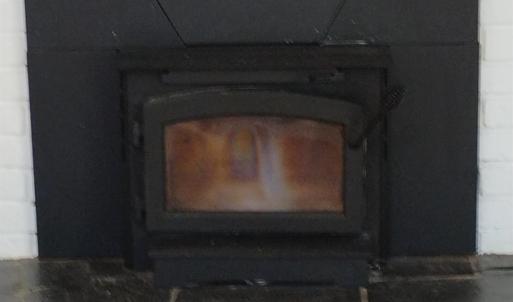 WOOD STOVE INSERT IN MAIN LEVEL DEN