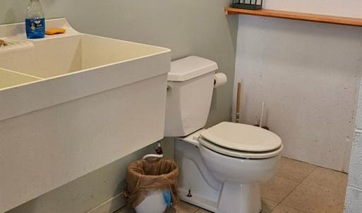 Full Bath in lower level between the garages.