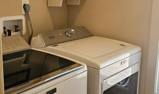 Laundry room w/ pocket door off of primary bathroom isso convenient. This area isl also accessible off of sunroom