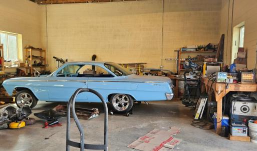 You could actually probably house 5 cars in this garage or even more if you add two lifts in this area. With 14' ceilings you could even add a loft for added storage.