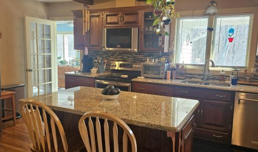 Large kitchen with granite & Stainless-Steel appliances