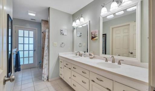 Primary bath - double sink vanity with Corian countertop