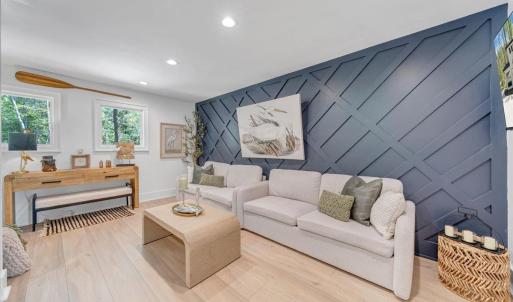 Enter the upper level loft/living room, full bath and 2 additional bedrooms each with access to the upper covered deck overlooking the lake!