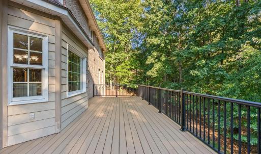 New composite deck and black iron railing.