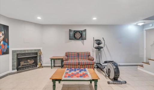 Basement rec room with easy maintenance ceramic tile floor