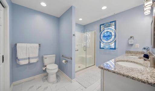 Large bathroom en suite in the addition, outfitted with grab bars