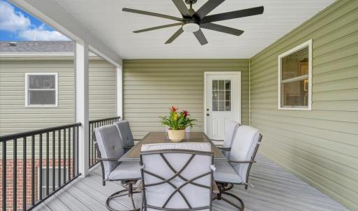 Screened in porch with an entrance to the addition