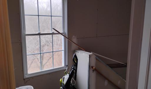 ENTERANCE TO BASEMENT OFF LAUNDRY ROOM