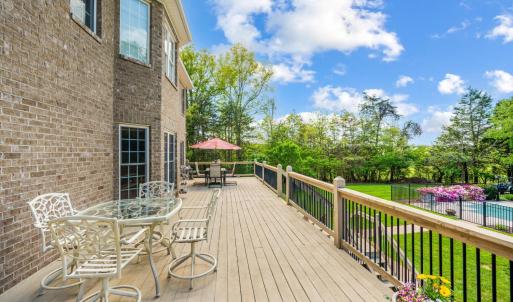 Expansive deck space overlooking the grounds and pool