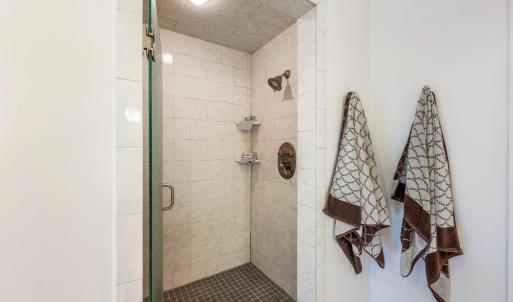 Primary shower room with two shower heads!