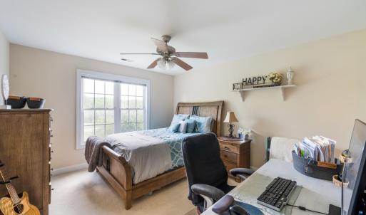 Large bedroom with walk in closet, private sink, and jack and Jill toilet and bath.