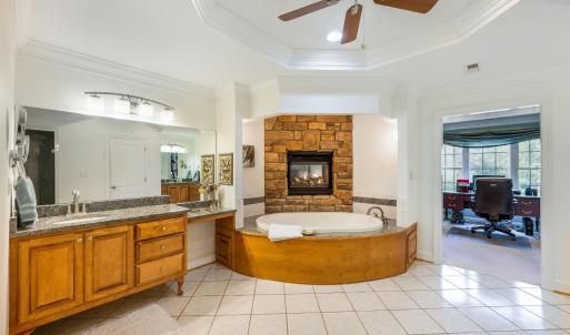 Primary bathroom unsuited with jacuzzi tub, and fireplace!