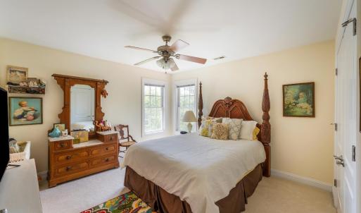 Bedroom with private sink and jack and Jill toilet and bath.